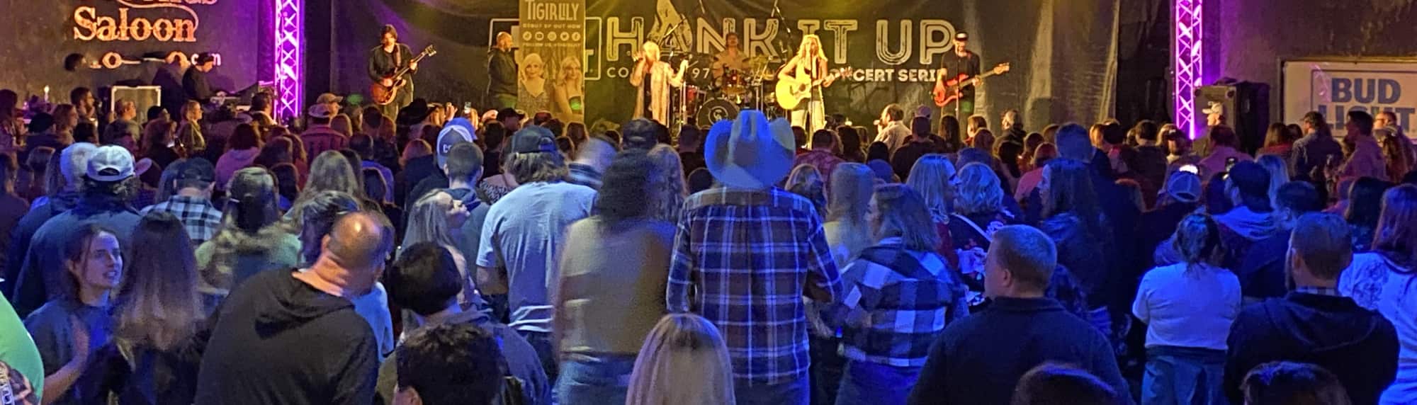 country concert with fans wearing cowboy hats Savannah